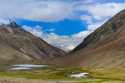 Scenic view of mountains against cloudy sky at leh ladakh
