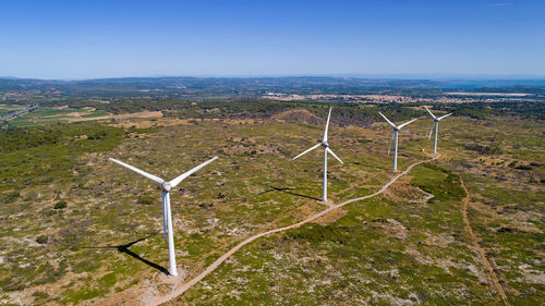 Scenic view of landscape against clear blue sky