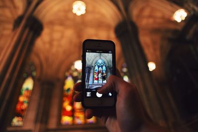 Woman photographing through smart phone