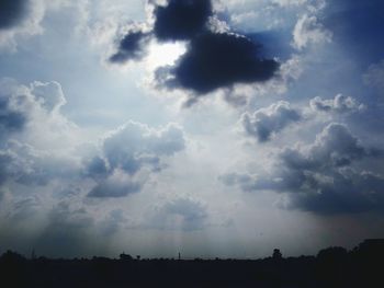 Silhouette landscape against sky