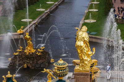 Statue by lake