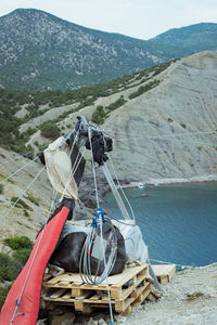 High angle view of traditional windmill on shore against mountains