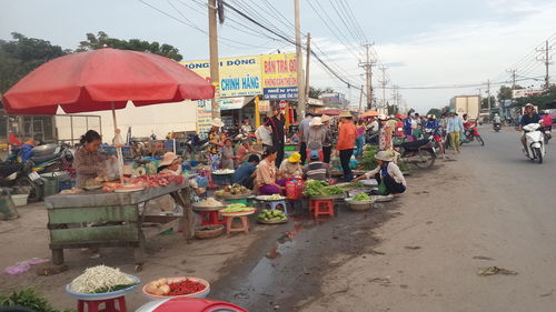 People at market stall