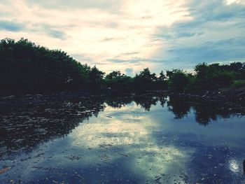 Scenic view of lake against sky during sunset