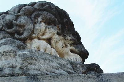 Low angle view of statue against sky