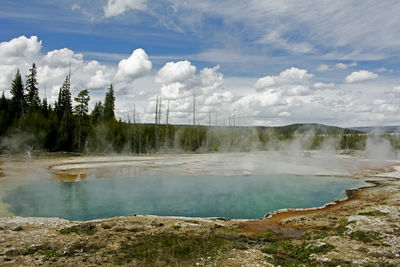 Scenic view of lake at yellowstone national park against sky