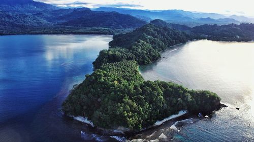 Scenic view of river amidst mountains against sky