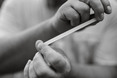 Close-up of woman holding cigarette