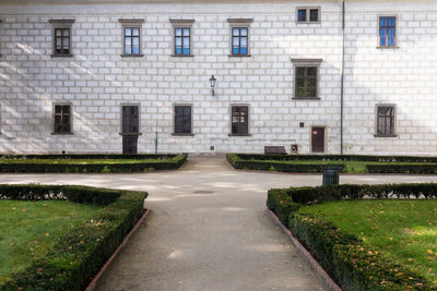 Empty road by building