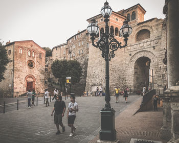 Group of people in front of historic building