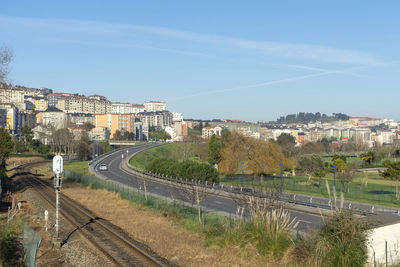 Panoramic view of buildings in city against sky