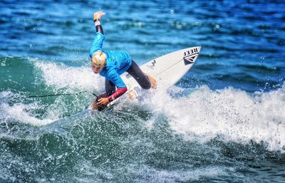 People surfing in sea