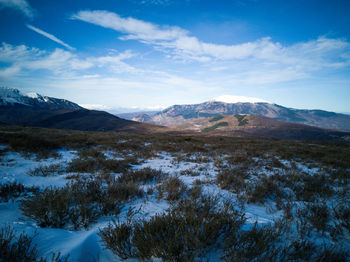 Scenic view of snowcapped mountains against sky