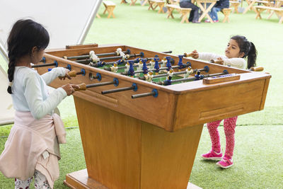 Cute girl playing foosball 