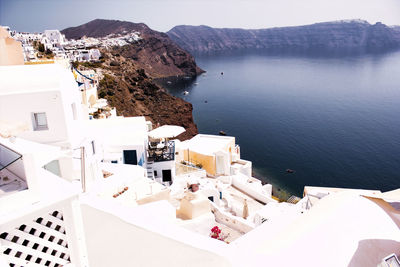 High angle view of buildings by sea