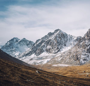 Scenic view of snowcapped mountains against sky