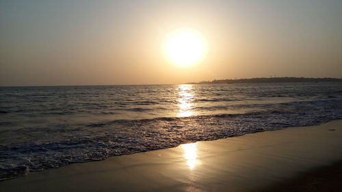 Scenic view of sea against clear sky during sunset