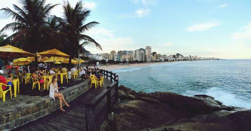 View of palm trees at seaside