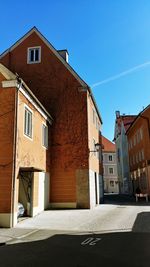 Residential buildings against blue sky