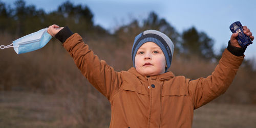 Portrait of boy standing in winter