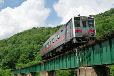 Kiha 54 special rapid train kitami that crosses the ishikari river