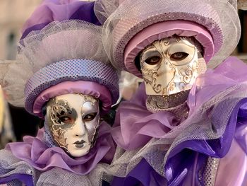 Close-up of people wearing masks and costumes
