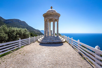 View of sea against clear blue sky