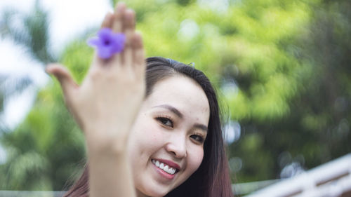 Portrait of smiling young woman outdoors