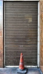 Against brick wall