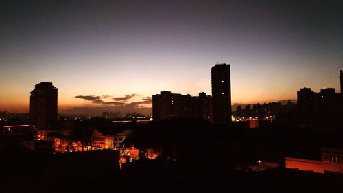 Silhouette of city at night