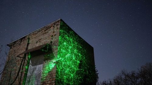 Low angle view of building against sky at night