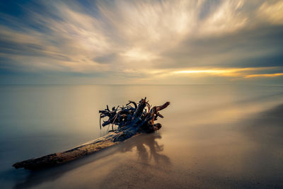 Scenic view of sea against sky at sunset