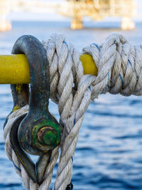 Close-up of rope tied on railing