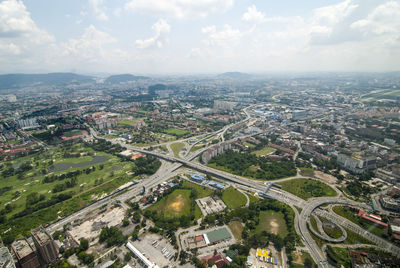 High angle view of city buildings against sky