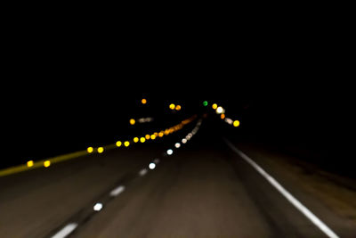 Defocused lights on road at night