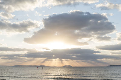 Scenic view of sea against sky at sunset