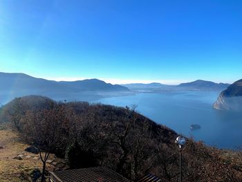 Scenic view of mountains against clear blue sky