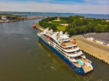 High angle view of ship by sea against sky