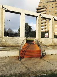Staircase of building against sky in city