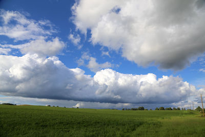 Scenic view of landscape against cloudy sky