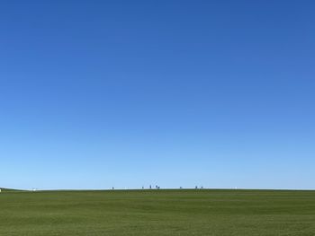 Scenic view of landscape against clear blue sky