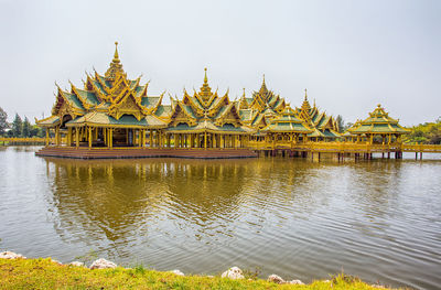 Temple by building against sky