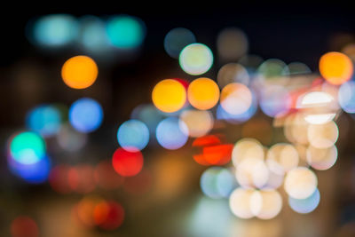 Defocused image of illuminated lights at night