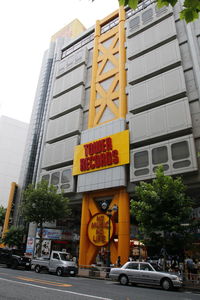 Low angle view of yellow building against sky