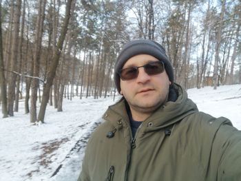 Portrait of man in sunglasses during winter