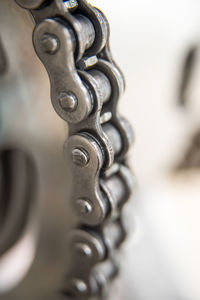 Close-up of metal chain against wall