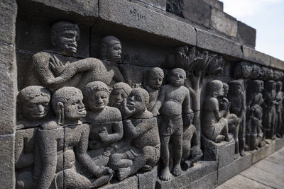 Statues in temple outside building