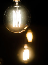 Close-up of illuminated light bulb