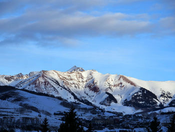 Scenic view of snowcapped mountains against sky