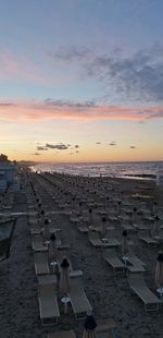 Scenic view of beach against sky during sunset